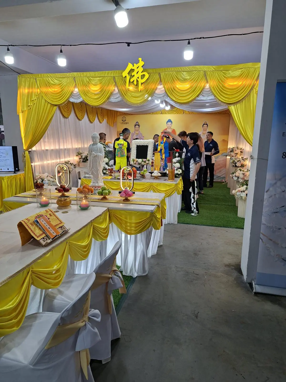 Buddhist funeral wake altar with family in Singapore