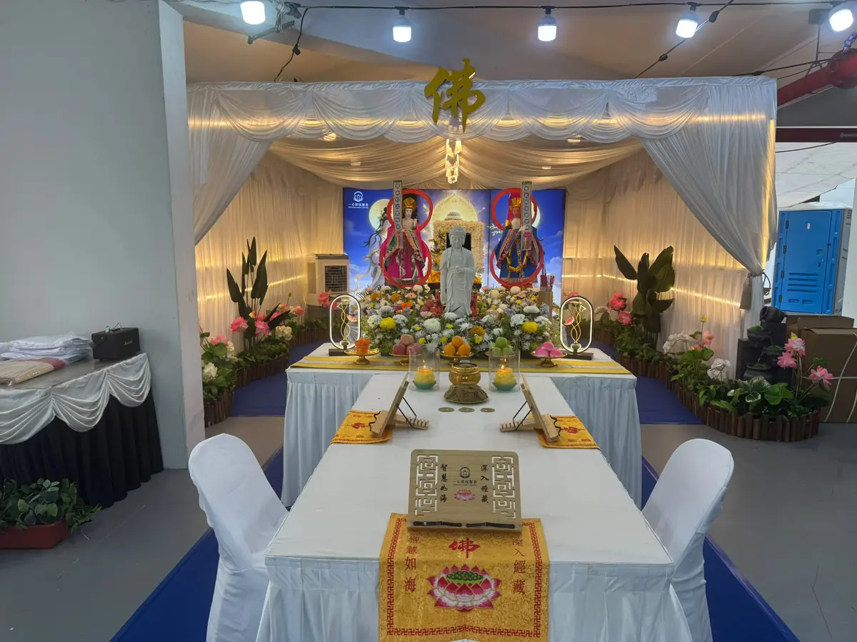 Complete Buddhist funeral altar with monk chanting area