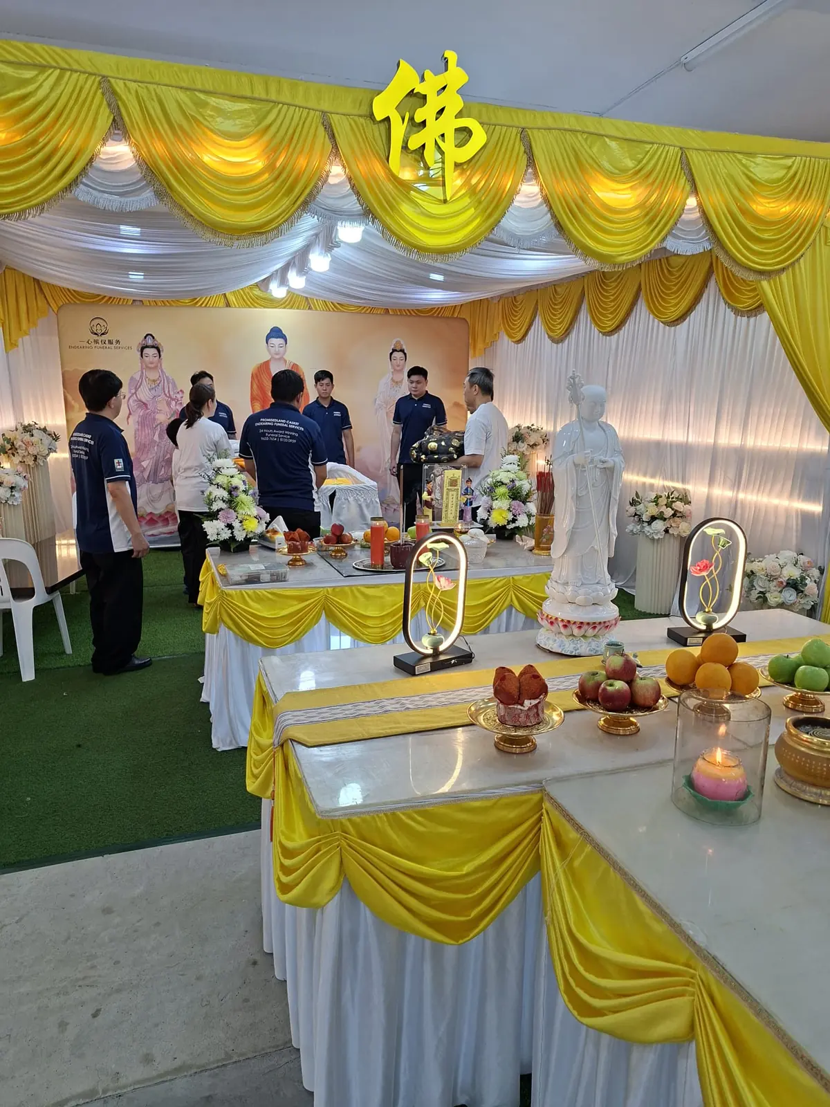 Buddhist funeral offering table and altar setup