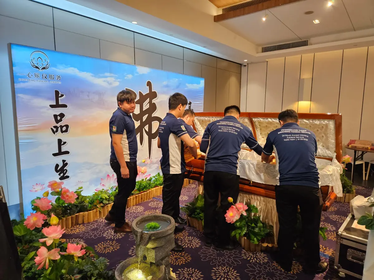 Funeral team preparing the casket for final rites