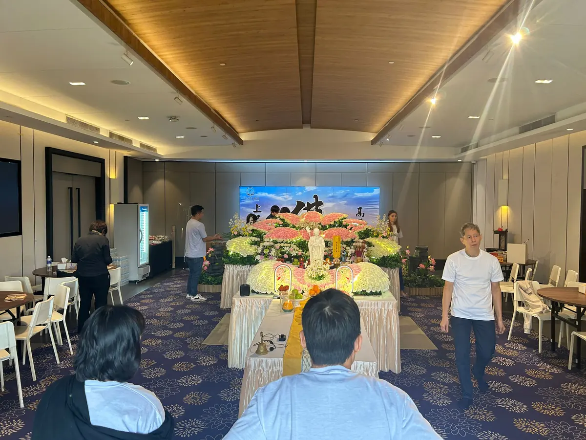 Family attending a Buddhist funeral wake in Singapore